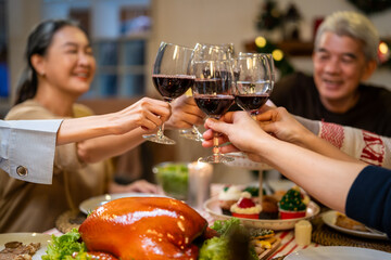 Asian lovely family celebrating christmas party together in house. 