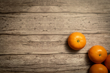 Orange fruit on the wood. Mandarine oranges. Tangerine oranges. Orange color. Fresh orange juice.