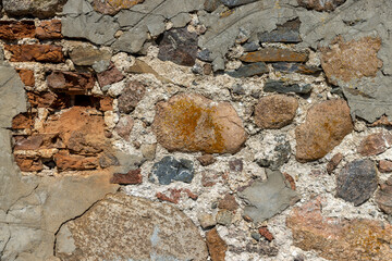 ancient wall of cobblestones and red bricks
