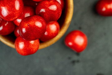 delicious collected and wet cherry berries with pits