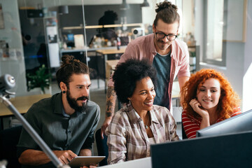 Mixed team of software engineers brainstorming ideas. Diverse app developers collaborating as group - Powered by Adobe