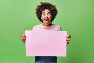 Excited Young Woman Holding Blank Pink Signboard