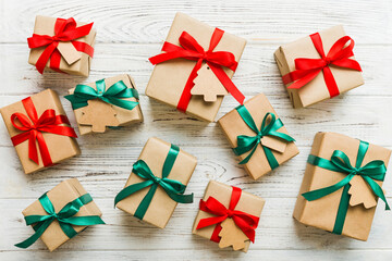 Colored craft gift boxes with colorful ribbons on colored background. Collection of Christmas...