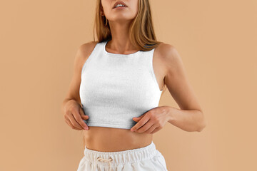 Modern Fashion Trends. No-face woman wears a white crop top and white shorts. Contemporary...