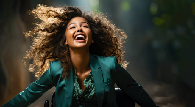 Excited happy young girl in a wheelchair rejoices in victory, new opportunities, gets good test results
