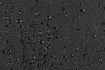 Water drops on dark stone