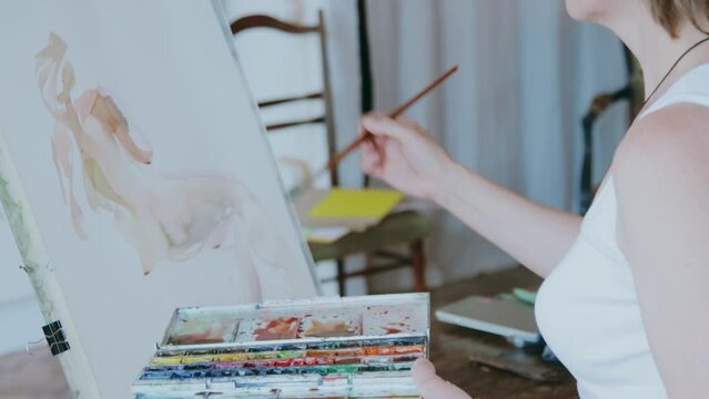 An artist at work in her studio