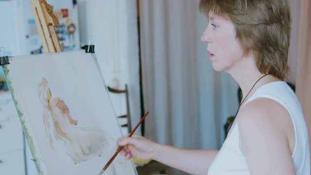 An artist at work in her studio