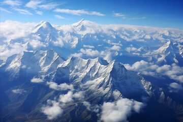 Naklejka premium Aerial view of sunrise over snowy mountains, foggy and cloudy, clouds, mountain peaks, snow-covered mountains