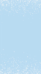 Fototapeta premium Beautiful snowfall christmas background. Subtle flying snow flakes and stars on light blue winter backdrop. Beautiful snowfall overlay template. Vertical vector illustration.
