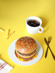 Hamburgers, fries and coffee on the table