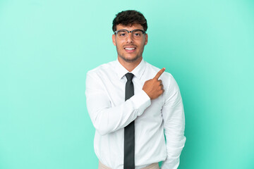 Business caucasian man isolated on blue background pointing to the side to present a product