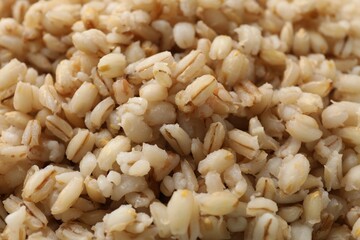 Delicious fresh pearl barley as background, closeup
