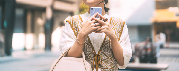 Casual business asian woman using smartphone city lifestyles with modern technology