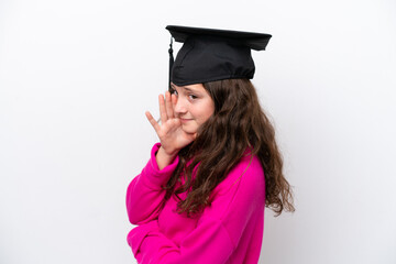 Little student girl wearing a graduated hat isolated on pink background whispering something