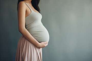 Pregnant woman is holding her big tummy. Generative AI