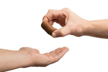 Charity concept: hand put a pile of coin on a reaching hand