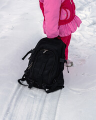 The girl in pink with the big backpack