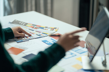 Creative digital development agency. developer brainstorming on their project with laptop,...