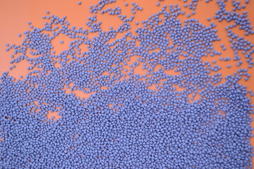 Gray compounds on an orange background