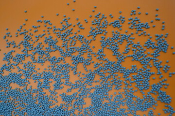 Gray compounds on an orange background