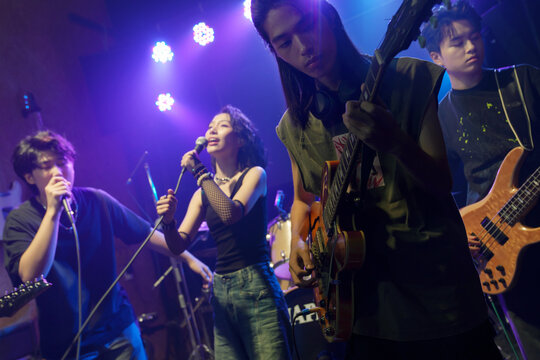 Young band performing on stage