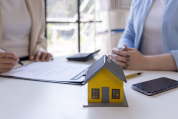 Real estate brokerage agent Deliver a sample of a model house to the customer buy or rent, Mortgage property tax insurance dream moving home and real estate concept