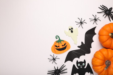 Obraz na płótnie Canvas Flat lay composition with Halloween decor on white background, space for text