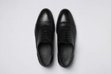 Pair of leather men shoes on white background, top view