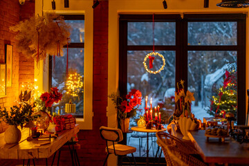 Fototapeta na wymiar Beautifully decorated table for a New Year's holidays at cozy home during festive evening
