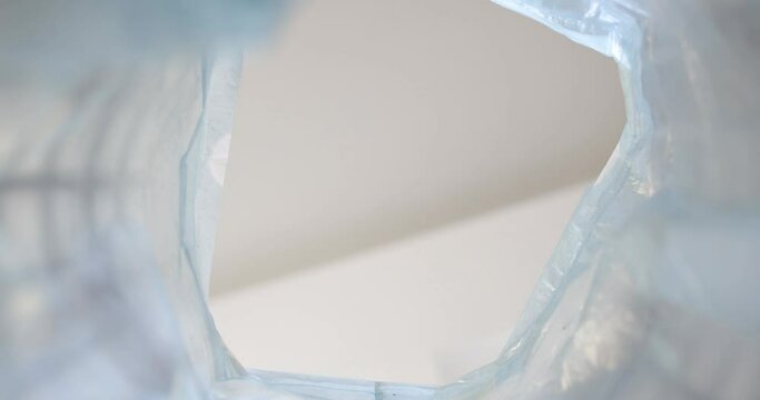 The view inside the empty pure blue garbage bag, close-up, static shot