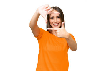 Young pretty caucasian woman over isolated background focusing face. Framing symbol