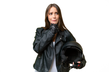 Young pretty caucasian woman with a motorcycle helmet over isolated background having doubts and thinking