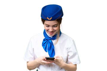 Airplane stewardess over isolated chroma key background sending a message with the mobile