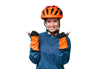 Young cyclist woman over isolated chroma key background with thumbs up gesture and smiling - obrazy, fototapety, plakaty