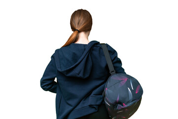 Young sport woman with sport bag over isolated chroma key background in back position