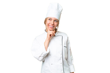 Young chef woman over isolated chroma key background thinking an idea while looking up