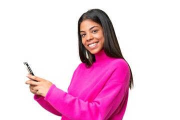 Young African American woman over isolated background sending a message or email with the mobile