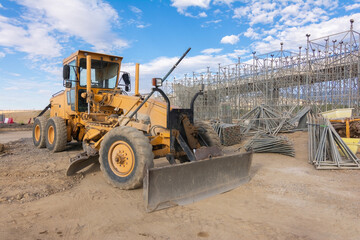 Excavator building a road in a site construction
