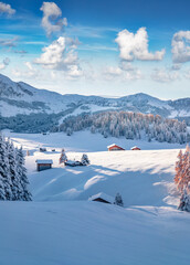 Christmas postcard. Snowy hills of Alpe di Siusi ski resort. Frosty winter landscape of Dolomite Alps, Italy, Europe. Perfect outdoor scene of Italian countryside. Beauty of nature concept background.