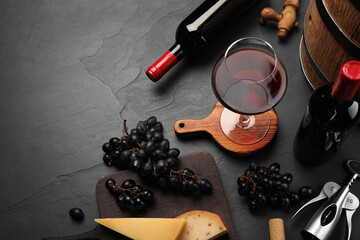 Winemaking. Composition with tasty wine and wooden barrel on gray table, above view. Space for text