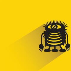 cartoon monster with shadow on yellow background