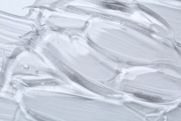 Cosmetic serum on white background, above view