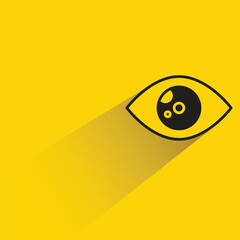 eye with shadow on yellow background