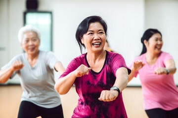 Middle-aged Asian women enjoy fun dancing, aerobics, and fitness classes. Dance class, zumba, karate