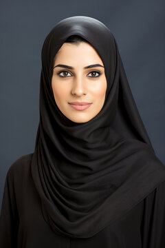 a woman wearing a black hijab and a black shirt