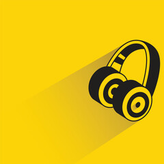 Naklejka premium headphone with shadow on yellow background
