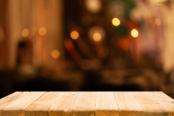 Empty beautiful wooden tabletop and blurred bokeh modern cafe interior background in clean and...