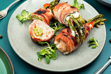 Beef meat rolls with young asparagus.