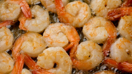 fresh fried shrimps in pan, close up